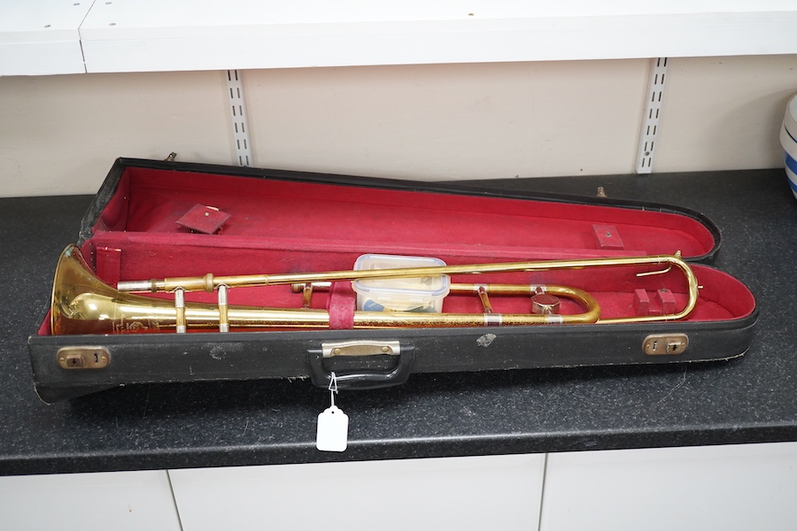 Three student trumpets by Beltone, etc. in soft cases and a cased Boosey & Hawkes trombone. Condition - poor to fair, all play